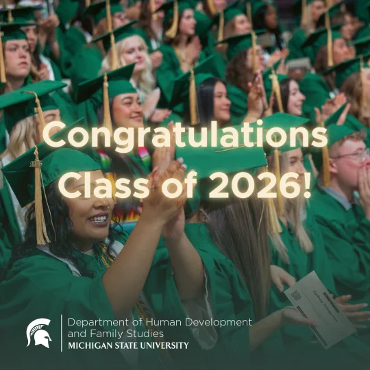 A crowd of graduates wearing green gowns and caps. Text overlay reads, \"Congratulations Class of 2026!\" The logo for the Department of Human Development and Family Studies at Michigan State University is in the corner.