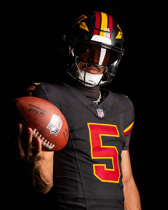 Photo of Jayden Daniels in our new black uniforms.