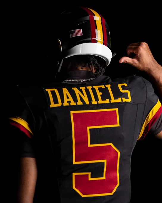 Photo of Jayden Daniels in our new black uniforms.