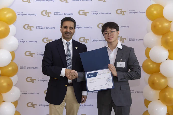 Photo of Ethan Yang accepting the Marshall D. Williamson Fellowship at the 35th Annual College of Computing Awards Celebration on April 20.