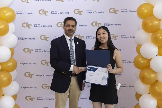 Photo of Grace Kim accepting the Donald V. Jackson Fellowship at the 35th Annual College of Computing Awards Celebration on April 20, 2026