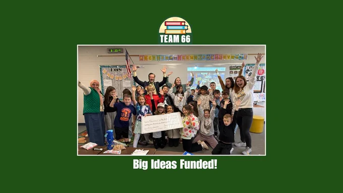 picture of classroom of students with big check 
