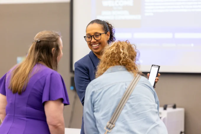 Laura Weir interacts with event participants at the 2026 School Finance Conference.