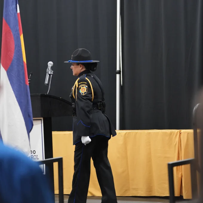 Corporal Elzi walking to microphone