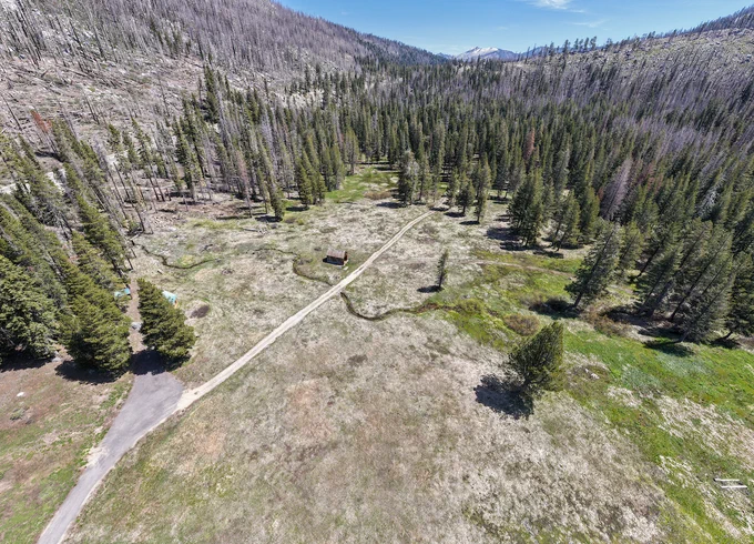 A drone view of where the California Department of Water Resources skipped its May snow survey at Phillips Station in the Sierra Nevada due to a lack of snow. The site, where four previous media snow surveys were held for the 2026 season, is approximately 90 miles east of Sacramento off Highway 50 in El Dorado County. Photo taken May 1, 2026. 

