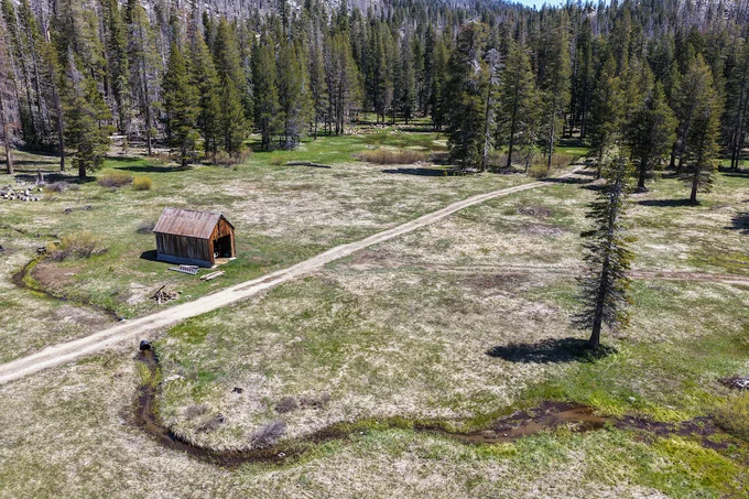 A drone view of where the California Department of Water Resources skipped its May snow survey at Phillips Station in the Sierra Nevada due to a lack of snow. The site, where four previous media snow surveys were held for the 2026 season, is approximately 90 miles east of Sacramento off Highway 50 in El Dorado County. Photo taken May 1, 2026. 

