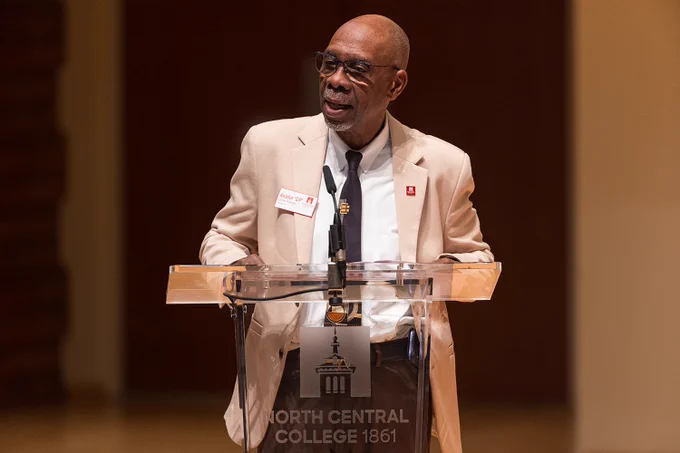 A photo of President G-P speaking at the podium in Wentz Concert Hall.