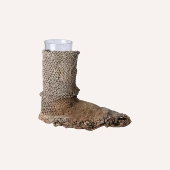 A picture of “Shoe Socks” made by the Ancient Pueblo people in the Southwest US and Mexico. The footwear is made of cotton, animal hair, and yucca.