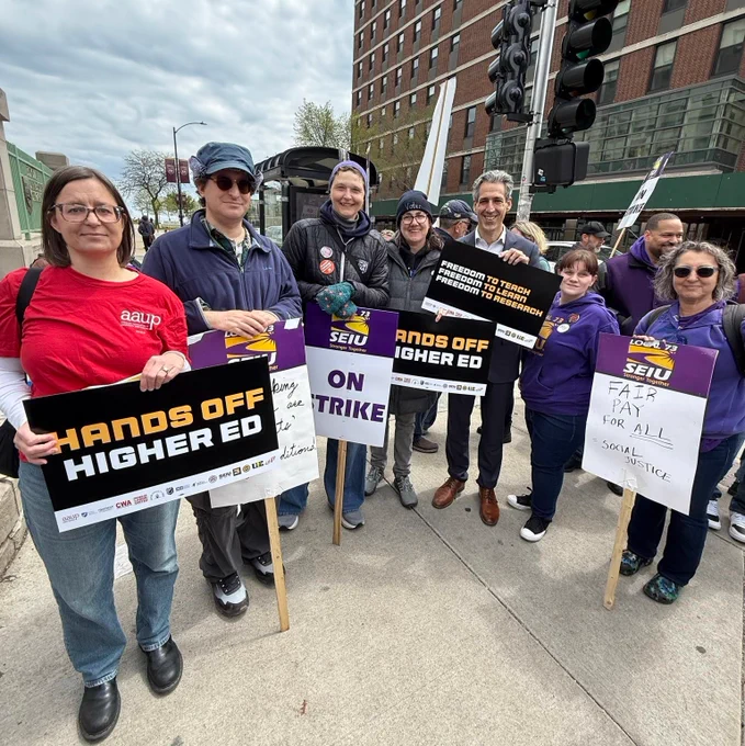 AAUP and SEIU workers rally with signs