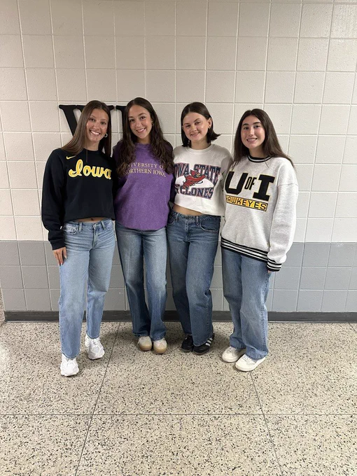 Four students smiling.