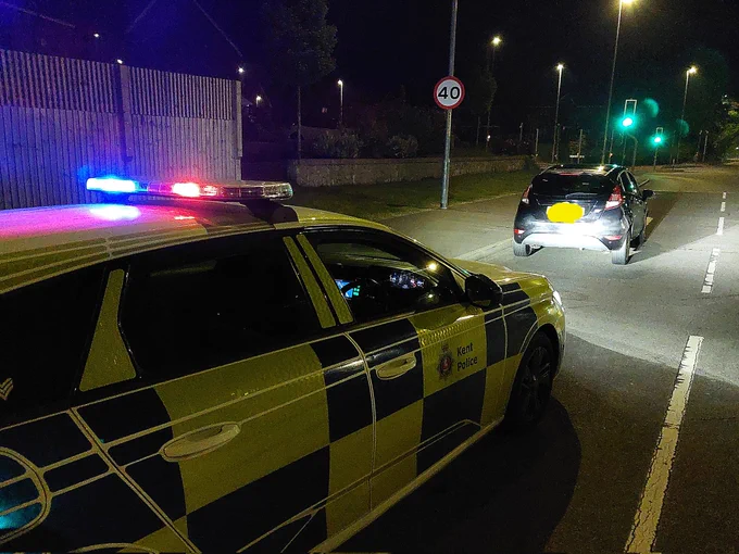 Police car and car seized for driver having no valid licence or insurance