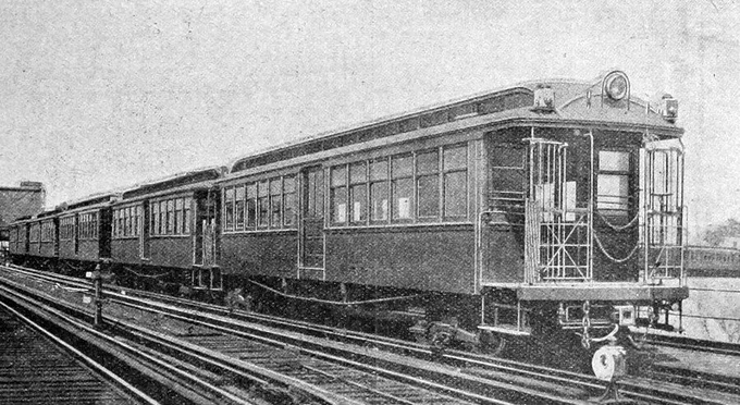 Three quarter view of a train of original 1903 Mersey Railway electric stock, the clerestory roof and gated car ends combined with a large central headlamp look like first generation American subway cars.