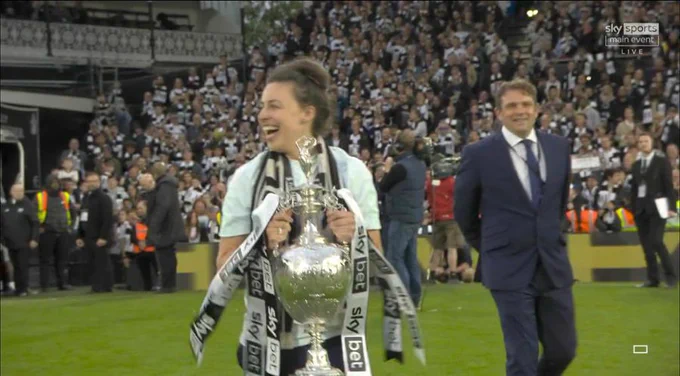 Fulham FC Women captain Mary Southgate - a lifelong #ffc fan - carries the Championship trophy on to the Craven Cottage turf after Fulham's 7-0 thrashing of Luton Town four years ago
