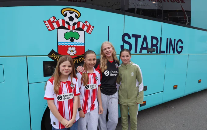 Southampton FC Women’s supporters pose outside a Starling branded coach before their trip up to Nottingham Forest
