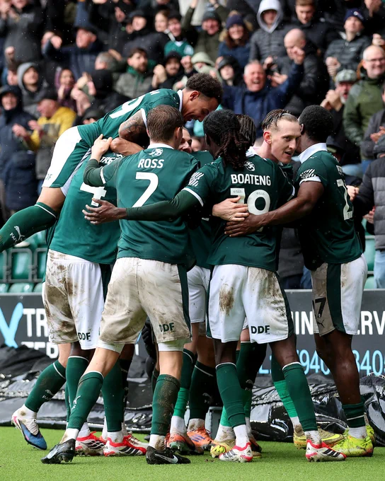 Argyle players celebrate together at Home Park.
