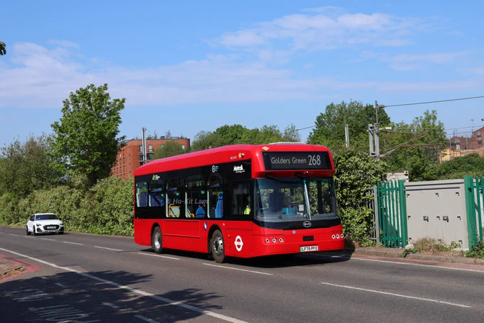 Metroline BEL3233 (LF75PFE) is a red BYD B12 and is pictured in Finchley Road as it heads to Golders Green on route 268.