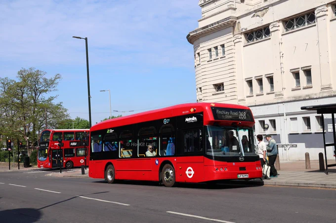 Metroline BEL3234 (LF75PFG) is a red BYD B12 and is pictured in Golders Green as it heads to Finchley Road, O2 Centre on route 268.