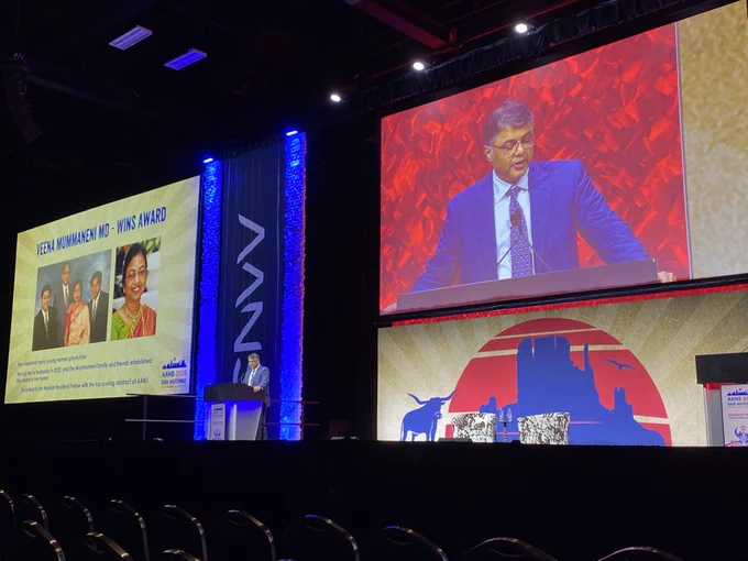 Praveen Mummaneni, MD, at the podium announcing the award, which was established in honor of Veena Mummaneni and is given to the woman resident or fellow with the top scoring abstract at AANS.
