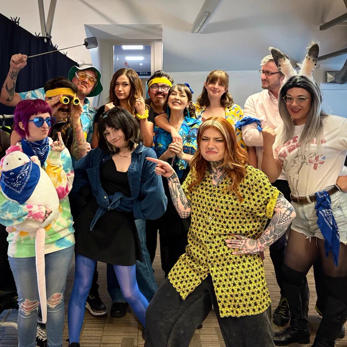 A group of Yogscast members decked in blue and yellow Camp Yog gear.