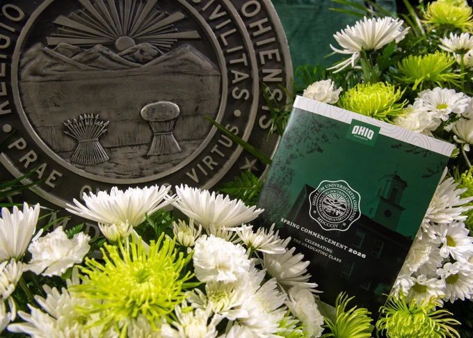 Ohio University Spring Commencement program surrounded by flowers and the state seal of Ohio.