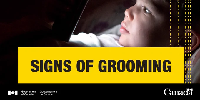 Image of young child in bed using a smartphone. Text:
Signs of grooming.