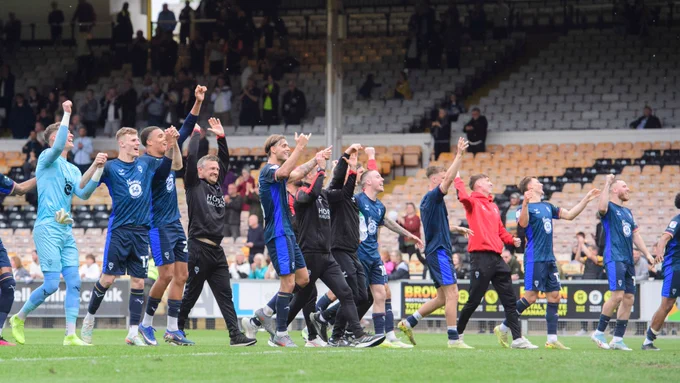 Lincoln City players celebrating.