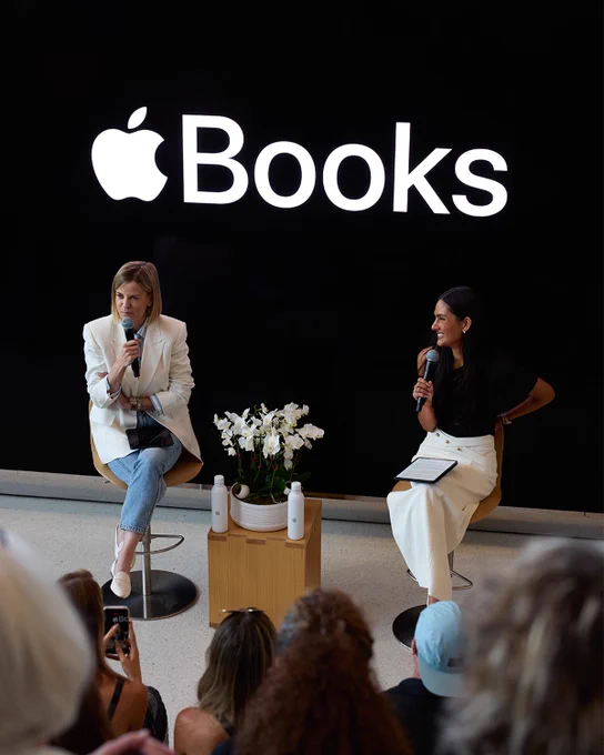 Susie Wolff and Lissie Mackintosh share the stage, both sitting down and holding microphones. An Apple Books logo is behind them.