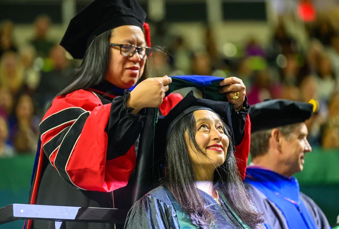 Graduate being hooded