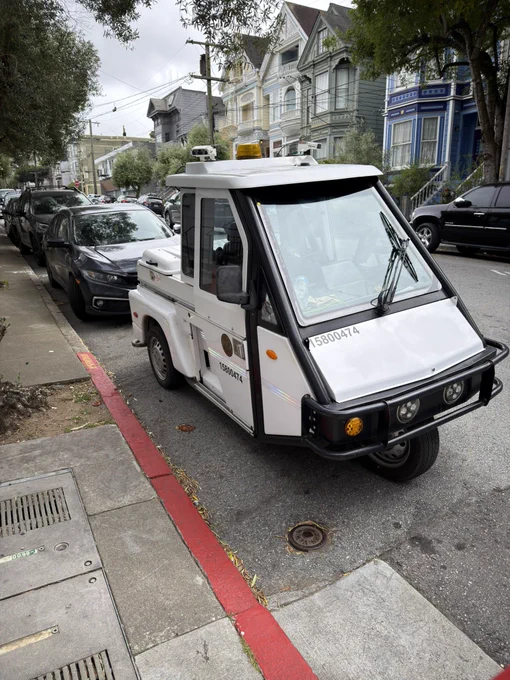 an sf parking enforcement vehicle parked illegally