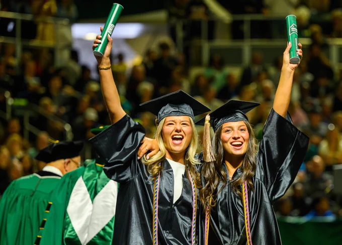 Ohio University alumni celebrate and embrace together at Commencement.