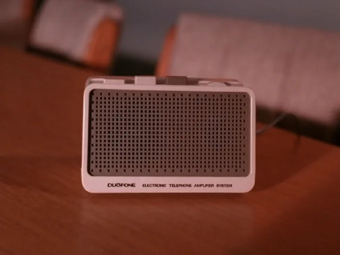 A static shot of a speakerphone from season one episode four of TWIN PEAKS, from which the voice of David Lynch as FBI Regional Bureau Chief Gordon Cole is emanating.