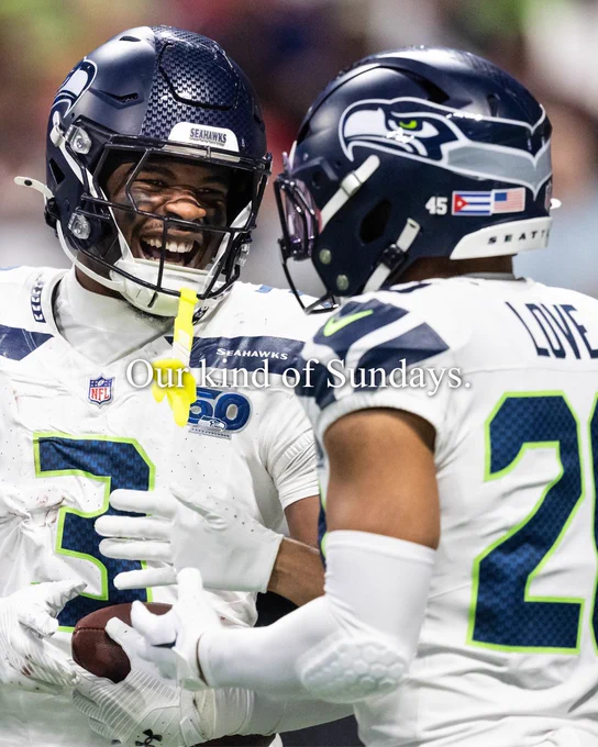 Nick Emmanwori and Julian Love celebrating. 