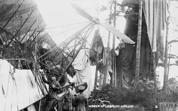 IWM RAE-O 1049 - "The wreck of the Lebaudy airship in Farnborough. The engine and one of the propellors can be seen in the foreground behind them is part of the remnants of the envelope." https://www.iwm.org.uk/collections/item/object/205192866