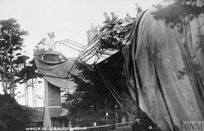 IWM RAE-O 565a - "The wreck of the Lebaudy airship in Farnborough. This photograph mainly shows the remains if the Gondola including the engines and propellers. Crowds can be seen gathering behind the fence in the background." https://www.iwm.org.uk/collections/item/object/205192656