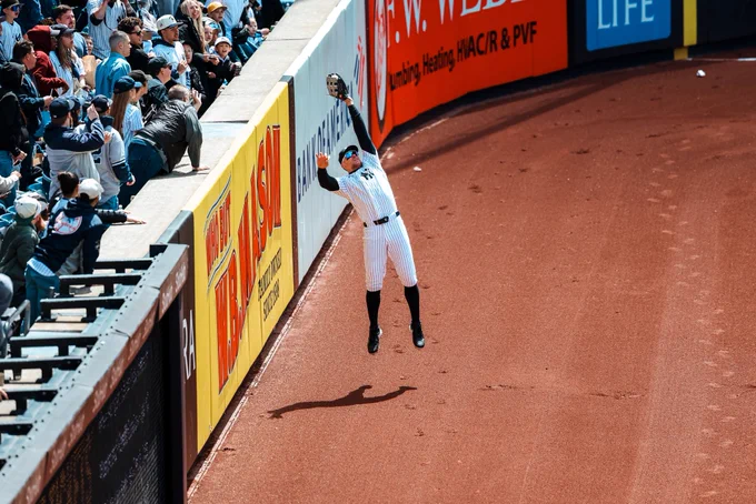 Aaron Judge makes a leaping catch in right field of Yankee Stadium.
