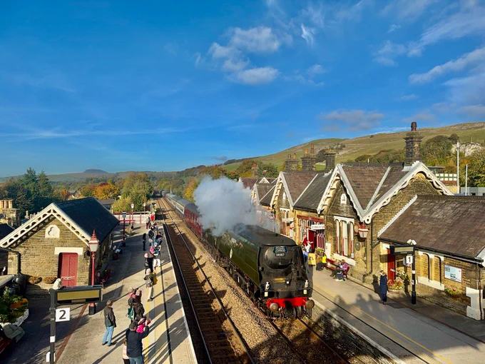 Steam train passing through Settle