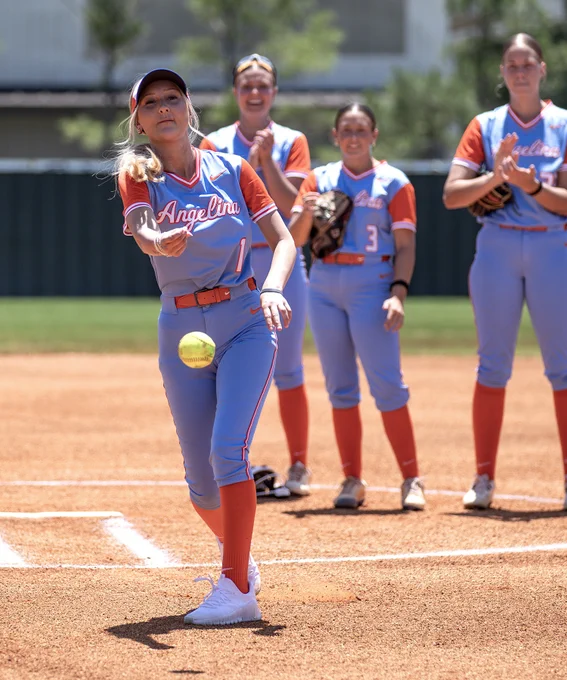 Addison Babbs throwing the first pitch