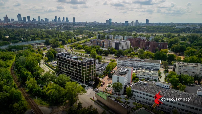 Aerial view of the CD PROJEKT RED building with the Warsaw skyline in the background.