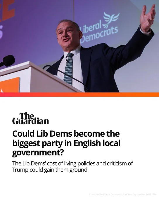 IMAGE: Ed Davey stands at a podium speaking at a Liberal Democrats event, gesturing with one hand raised. 

Behind him is a screen displaying the Liberal Democrats logo. 

Below the image is a Guardian-style graphic with the headline: “Could Lib Dems become the biggest party in English local government?” and the subheading says: The Lib Demś cost of living policies and criticism of Trump could gain them ground. 