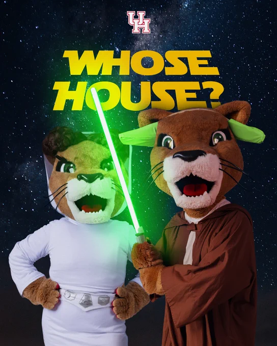 Sasha the UH mascot dressed as Princess Leia and Shasta dressed as Yoda with a green lightsaber. Yellow text above them reads, “Whose house?”