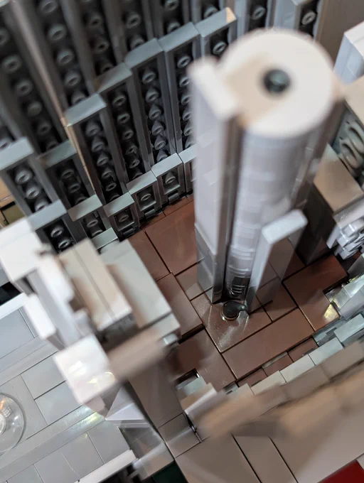 A small scale architecture lego model of the Atlanta Marriot Marquis, home of the Furry Weekend Atlanta convention. The model is opened up to reveal the lobby, showing off the central elevator shaft and lobby-bar