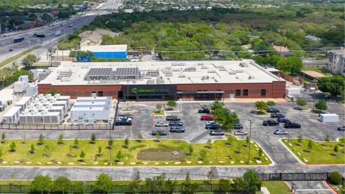 Data center and parking lot are near a highway.