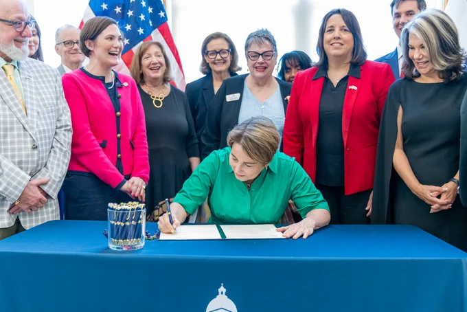 Governor Healey signing Executive Order.