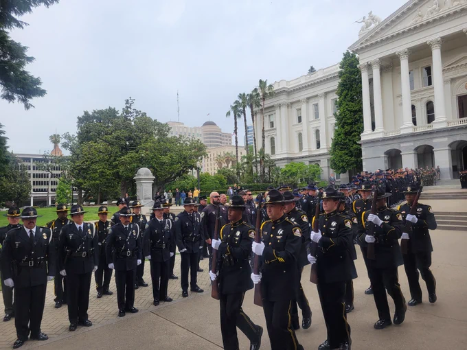 Peace officers march at the State Capitol memorial ceremony for fallen state peace officers. 