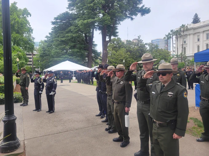 State Park Rangers saluting during the State Capitol memorial ceremony for fallen state peace officers. 