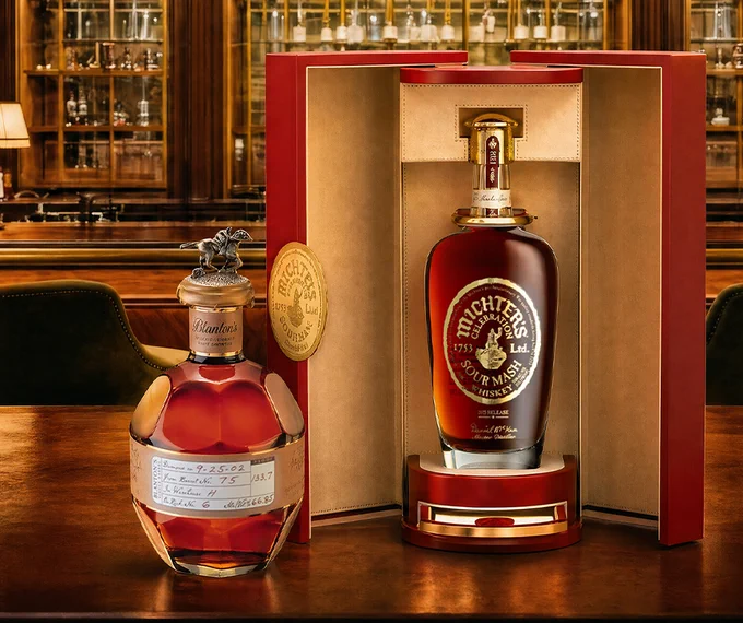 Two bottles of spirits, one bottle in front of a box, on a bar table.