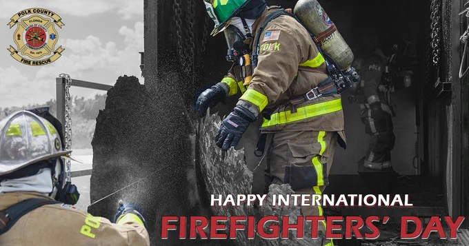 Firefighters extinguishing a fire, with "Happy International Firefighters’ Day" text.