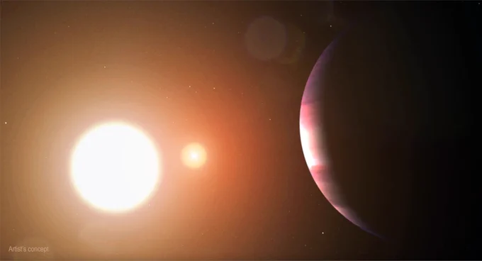 A gas giant planet looms in the foreground on the right, lit up by a pair of stars, in this artist's concept of a world in a binary system. One of the stars appears bigger and brighter than the other. There are also tiny, fainter stars in the background. Credit: NASA's Goddard Space Flight Center/Chris Smith (USRA)
