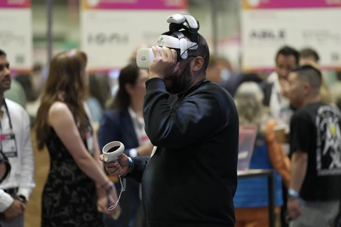 A person tests a VR headset at the B.C. Pavilion at Web Summit Vancouver.