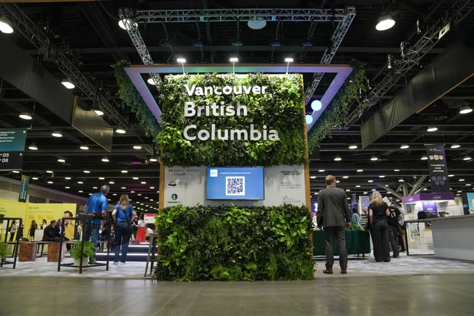 B.C. Pavilion at Web Summit Vancouver with greenery and large text display reading, “Vancouver, British Columbia.”